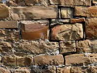 VENTANAL CRUCIFORME CEGADO EN MURO OESTE